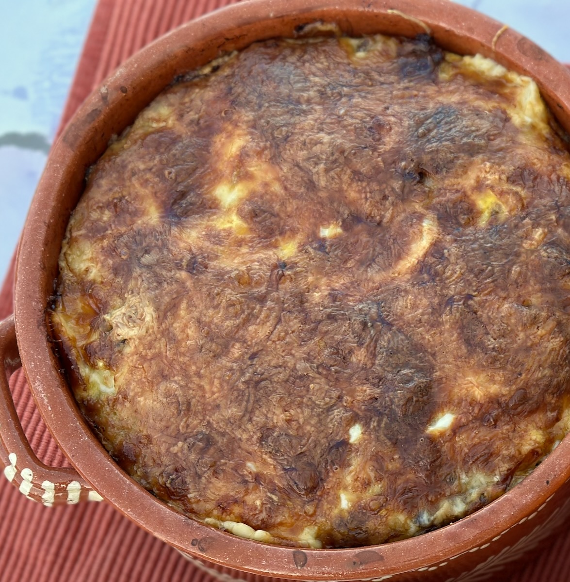 Savory pesto and sun dried tomato bread pudding