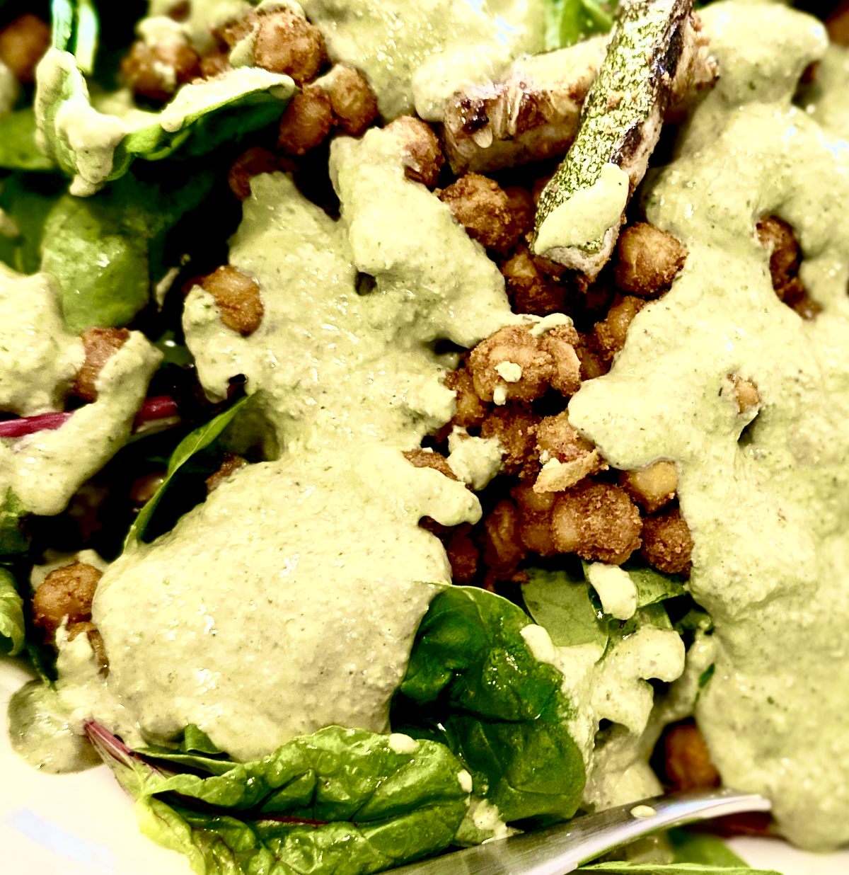 Mixed greens with spiced chic peas, grilled zucchini and green tahini dressing